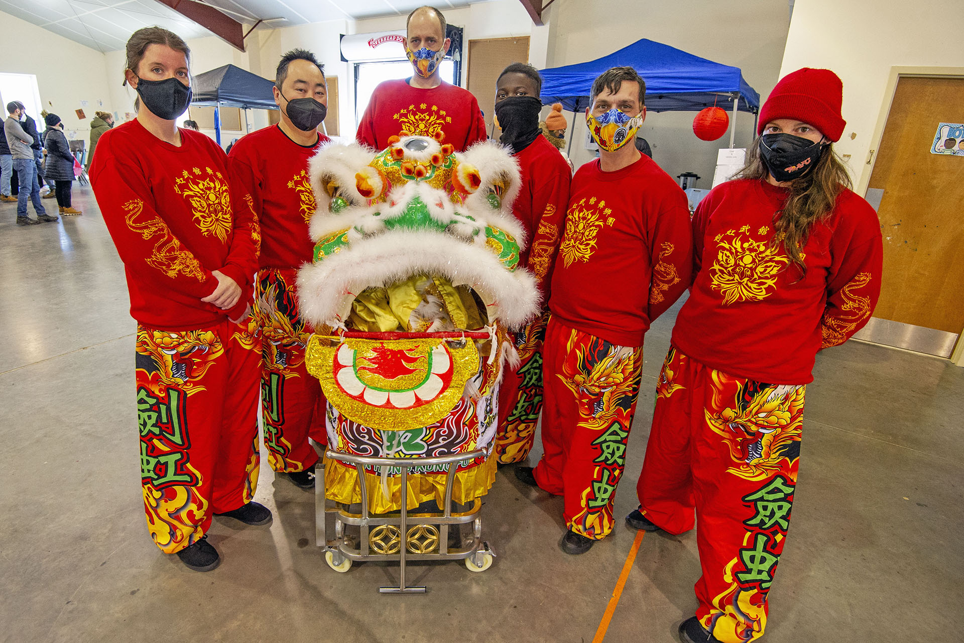 Members of Chein Hong School of Kung Fu pose for a photo before performing a Lion Dance during the Lunar New Year Celebration at Legacy Park in Decatur on Saturday, Jan. 29. 2022. Photo by Dean Hesse.