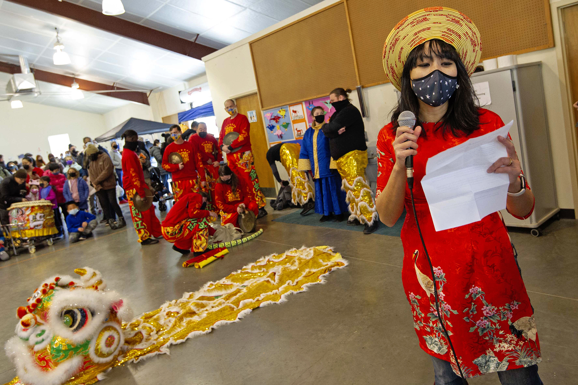 Organizer Han Pham makes announcements and introduces the Chein Hong School of Kung Fu Lion Dance performance during the Lunar New Year Celebration at Legacy Park in Decatur on Saturday, Jan. 29. 2022. Photo by Dean Hesse.
